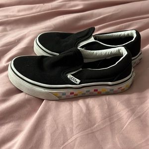 Size 12, black vans with rainbow checkerboard detailing.